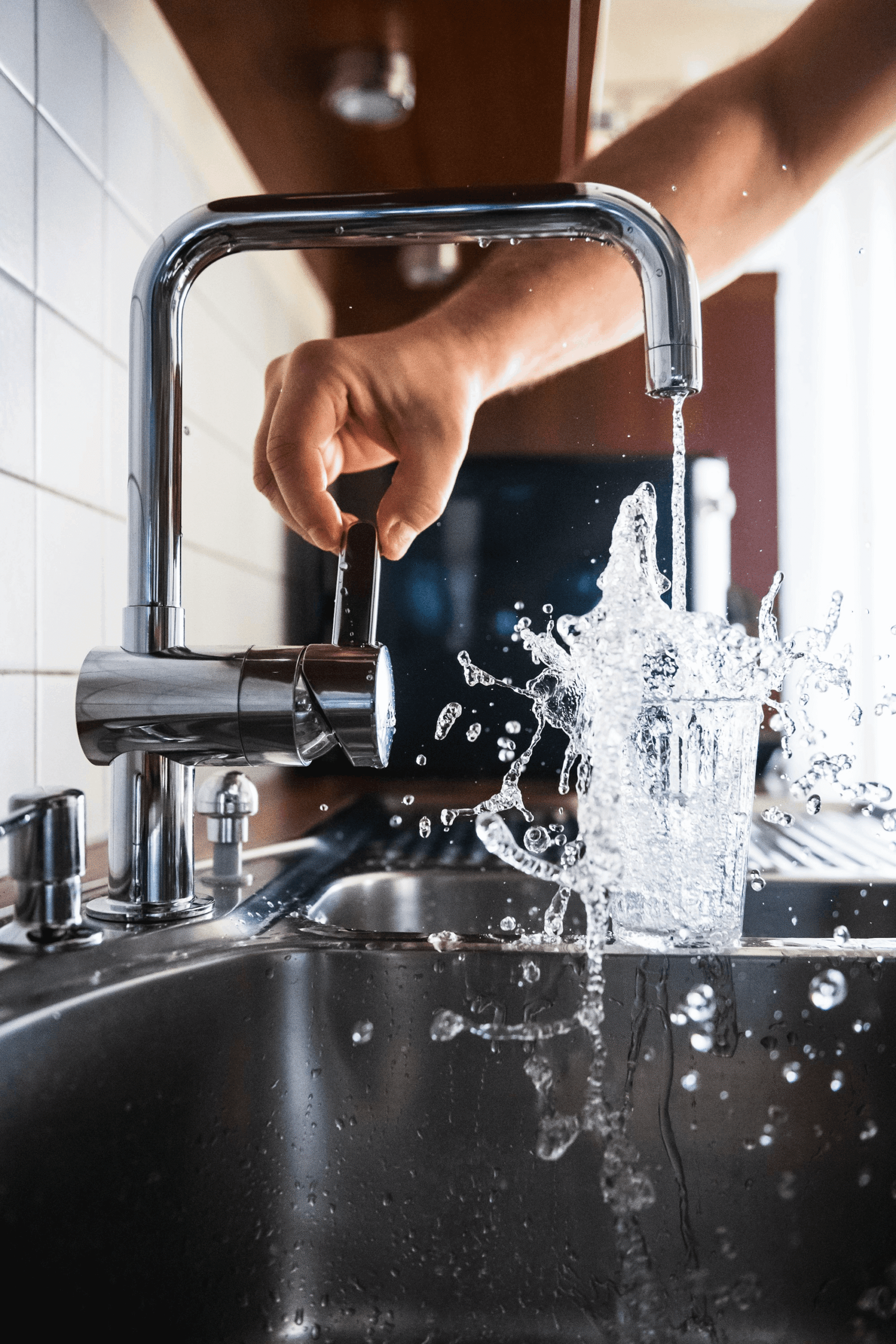 Water pouring from a clean tap